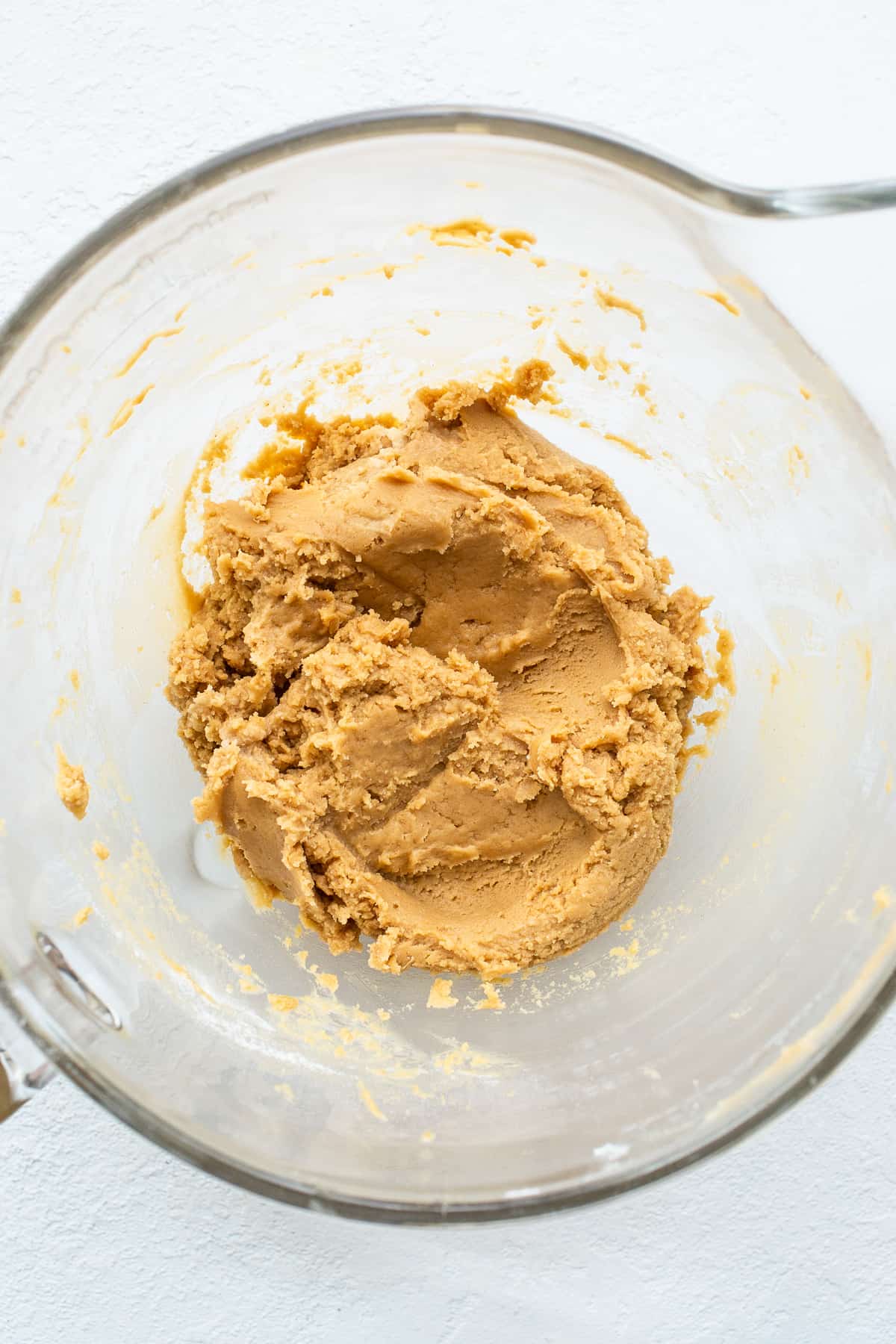 Peanut butter kiss cookies dough in a bowl.