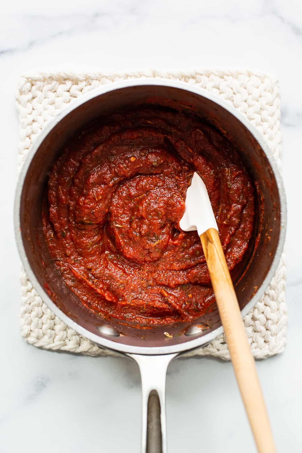 Homemade pizza sauce in a sauce pan.