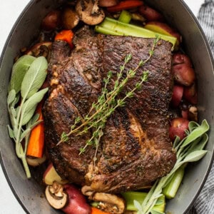 A pot full of vegetables and meat in a pan.