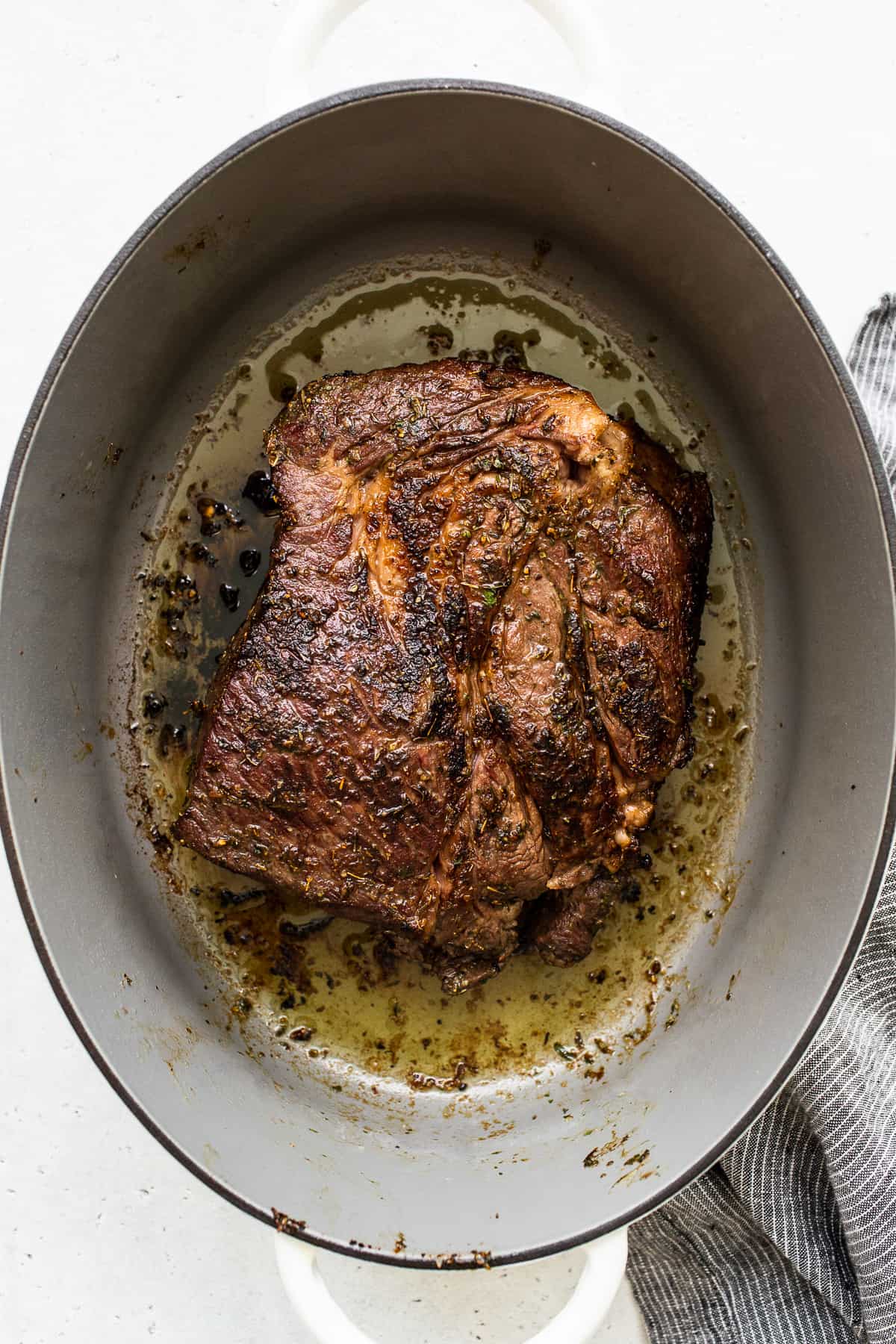 Seared chuck roast in a dutch oven.