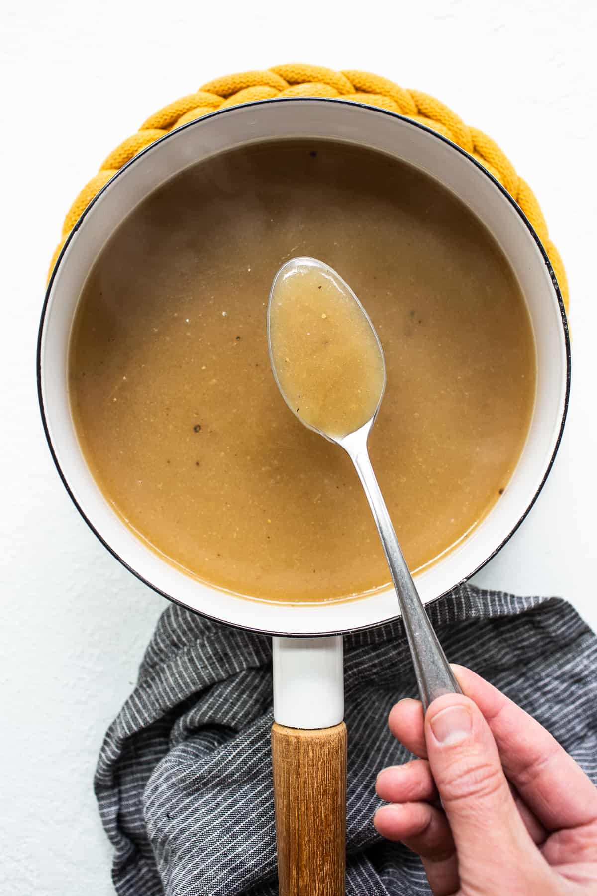 Turkey gravy on a spoon.