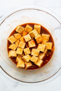 Tofu marinating in gochujang sauce.