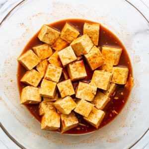 Tofu marinating in gochujang sauce.