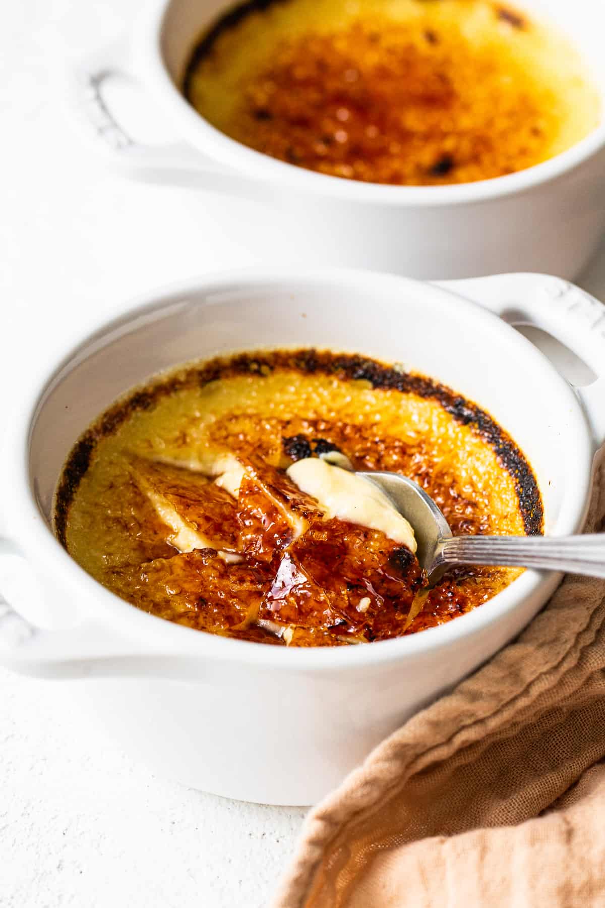 A spoon full of Eggnog Creme Brûlée. 