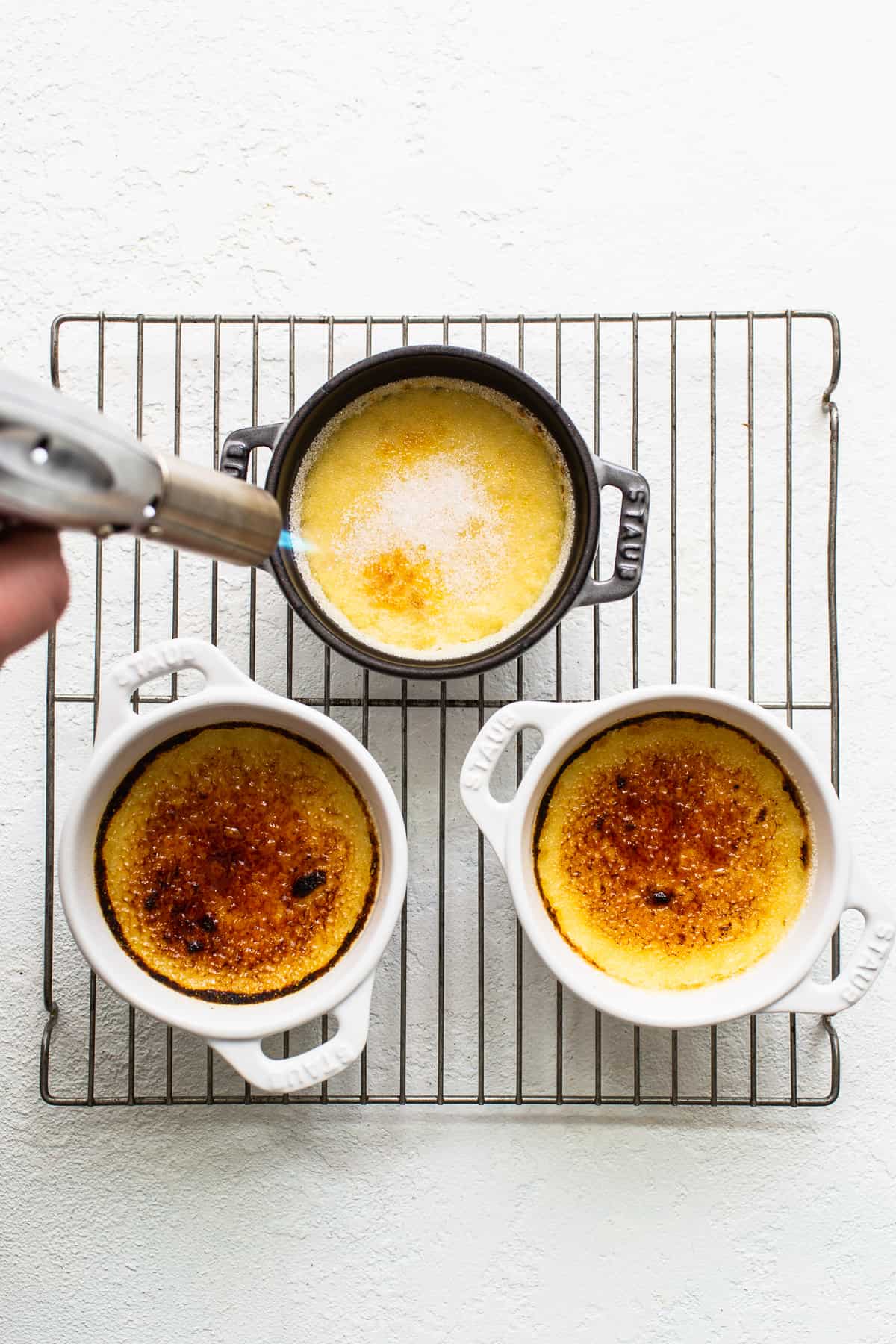 Torching the top of the Eggnog Creme Brûlée.