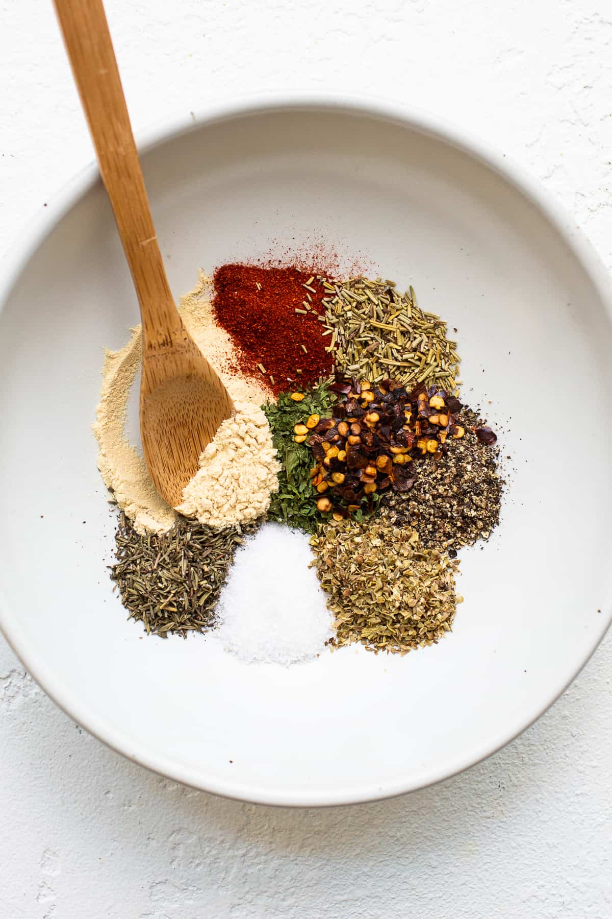 Dried spices for ground chicken bolognese in a bowl.