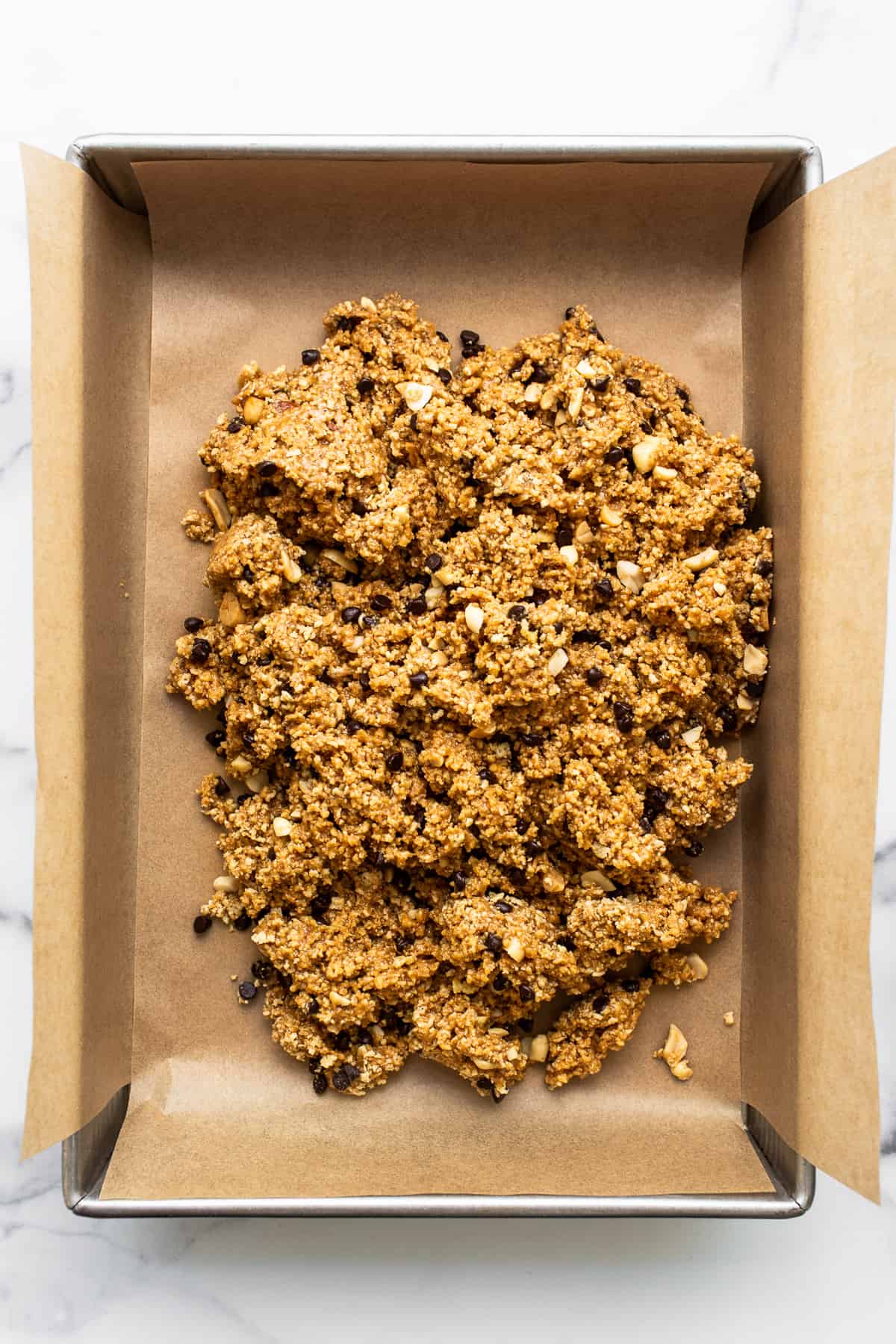 No bake peanut butter bar batter in a baking sheet.