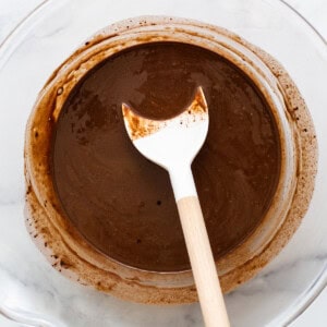 Melted freezer fudge ingredients in a bowl.