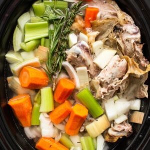 Homemade turkey broth in a crockpot.