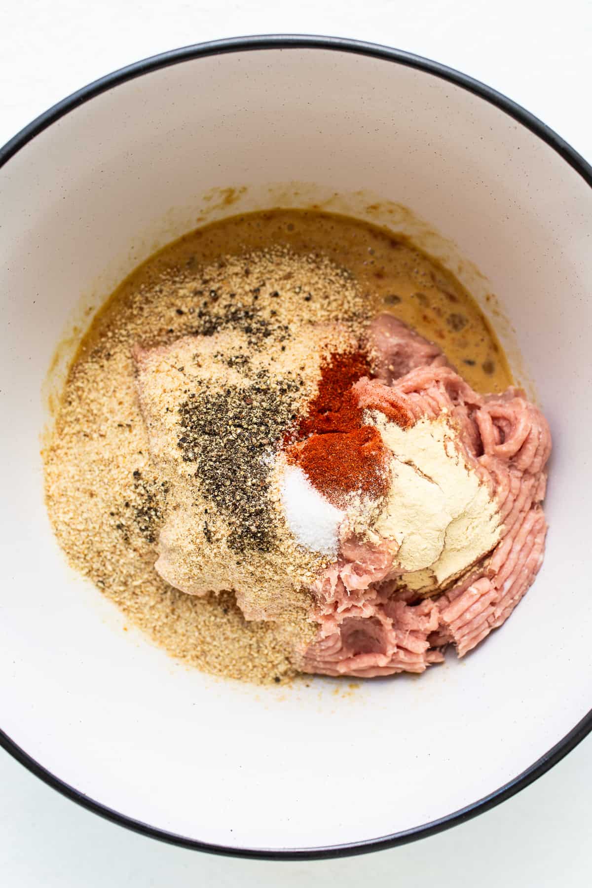 Ingredients for ground turkey meatloaf in a bowl.