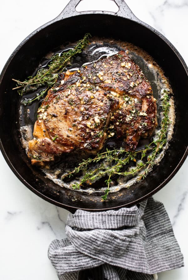 Steak in a cast iron pan.