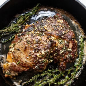 Cast iron steak in a pan.