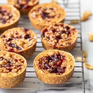 Peanut Butter and jelly cups on a metal rack.