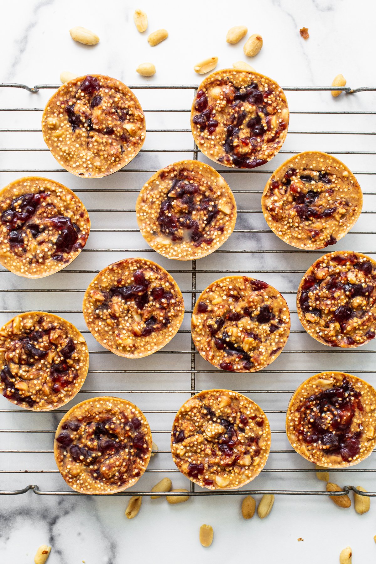 Peanut butter and jelly cups on a wire rack. 