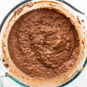 Chocolate batter in a glass bowl.