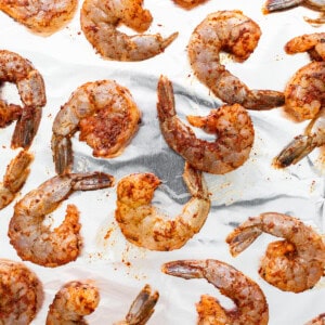 Shrimp on a sheet of aluminum foil.