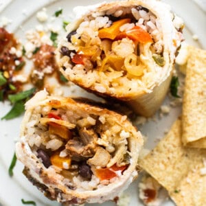 Chicken fajita burrito on a plate.