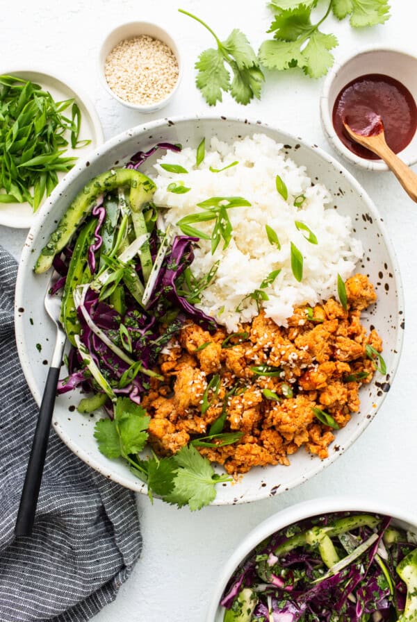 Ground chicken bowls with slaw and rice.