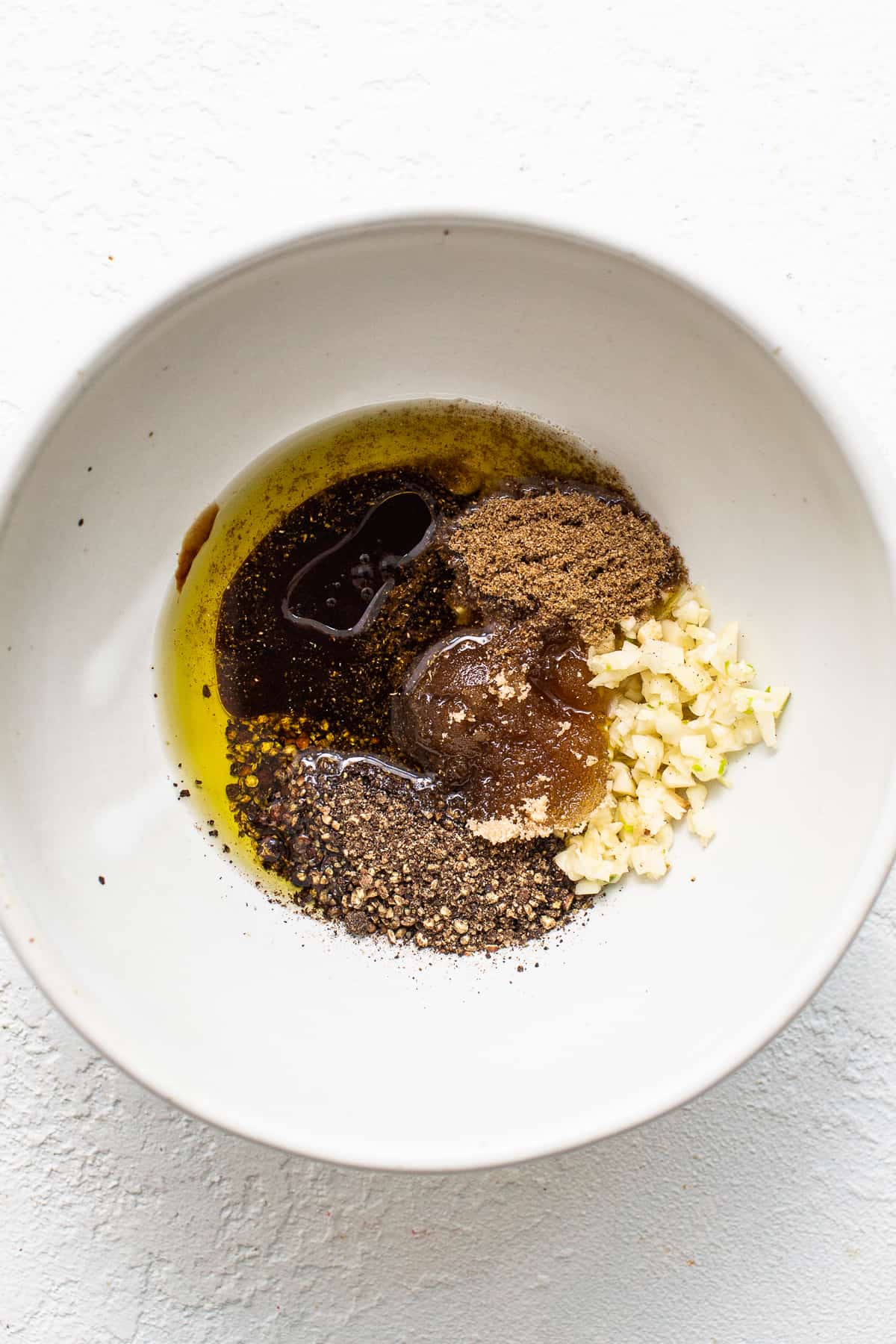 All of the ingredients for skirt steak marinade in a mixing bowl. 