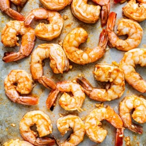 Grilled shrimp on a baking sheet.