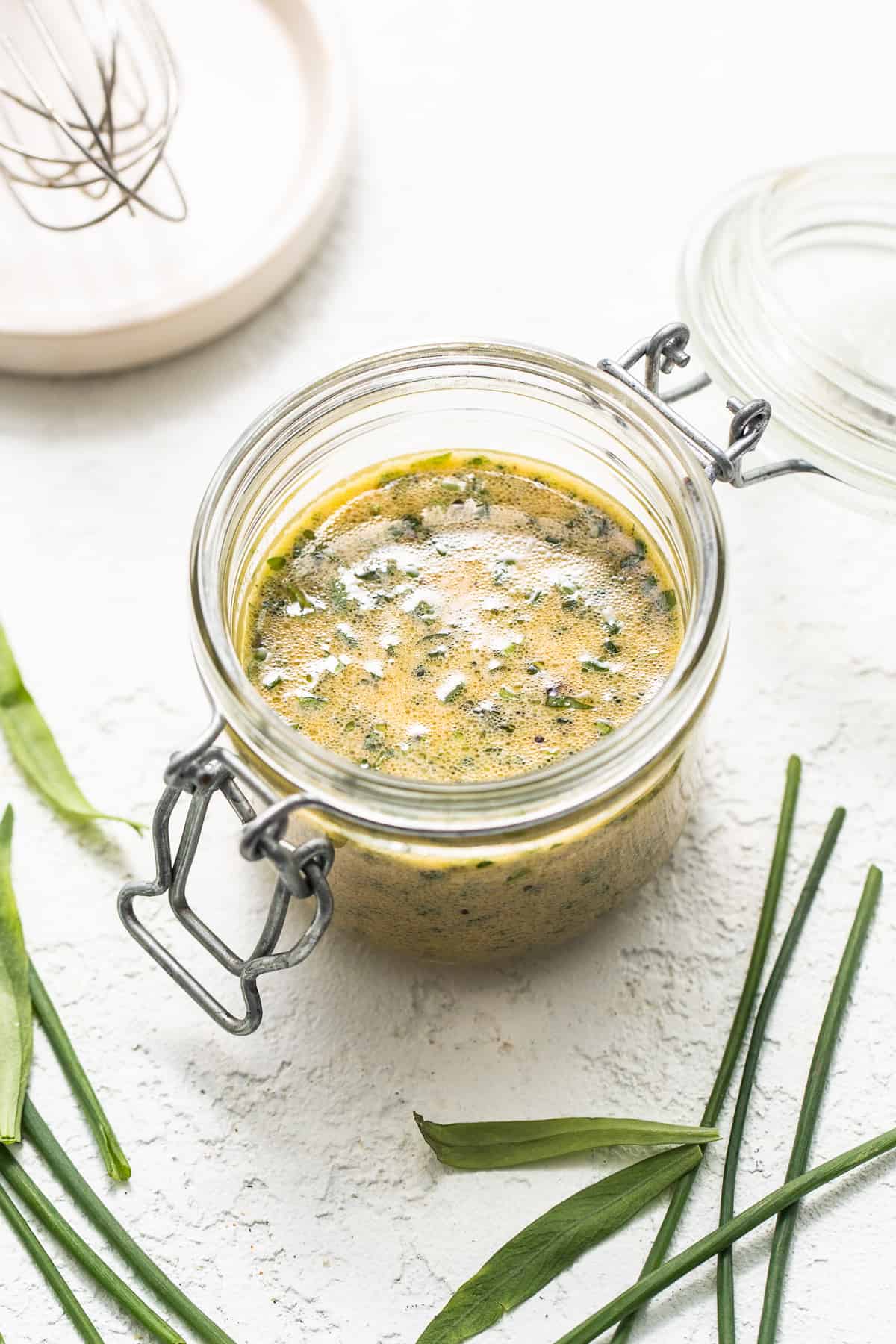 Homemade hummus dressing in a jar.