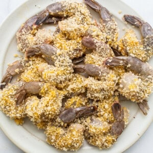 Fried shrimp with sesame seeds on a plate.