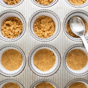 adding crust into muffin tin.