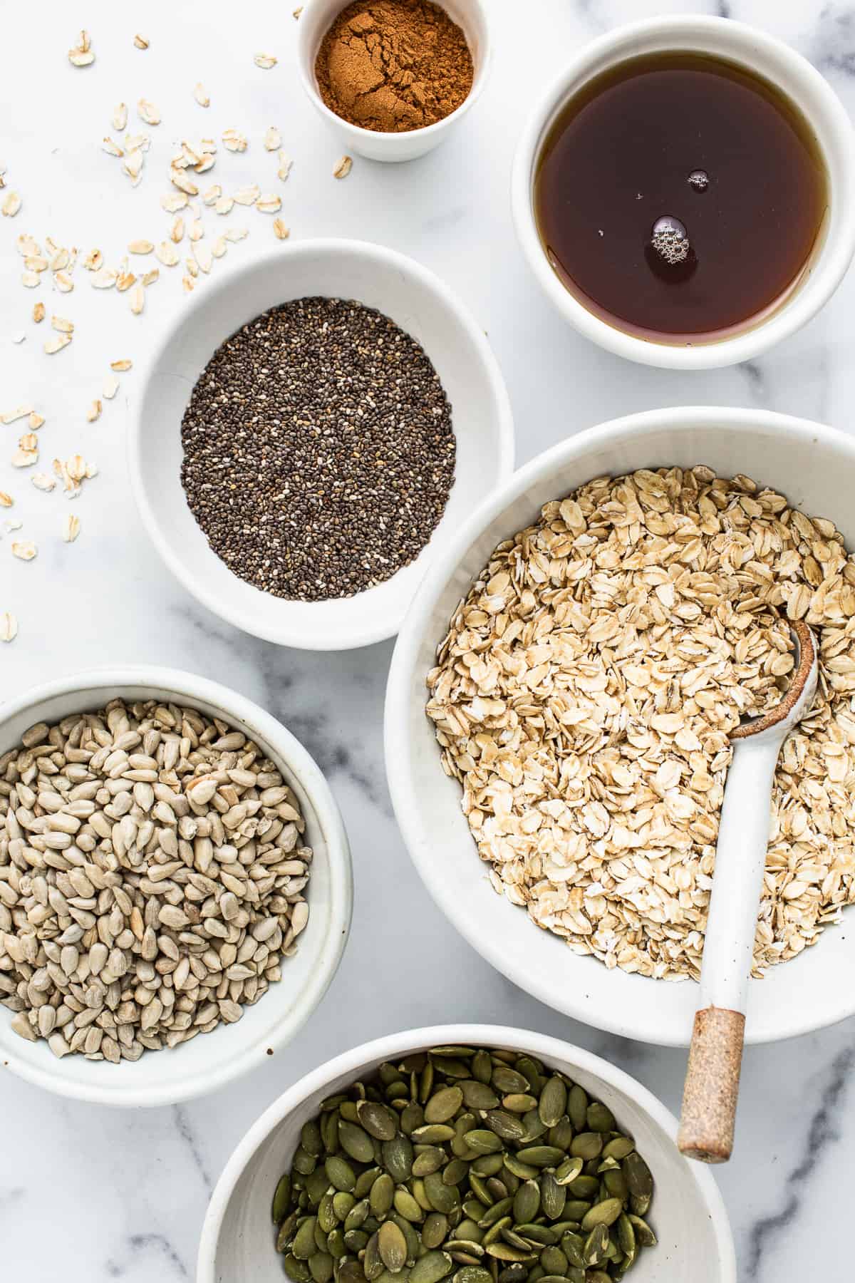 Ingredients for porridge in small bowls. 