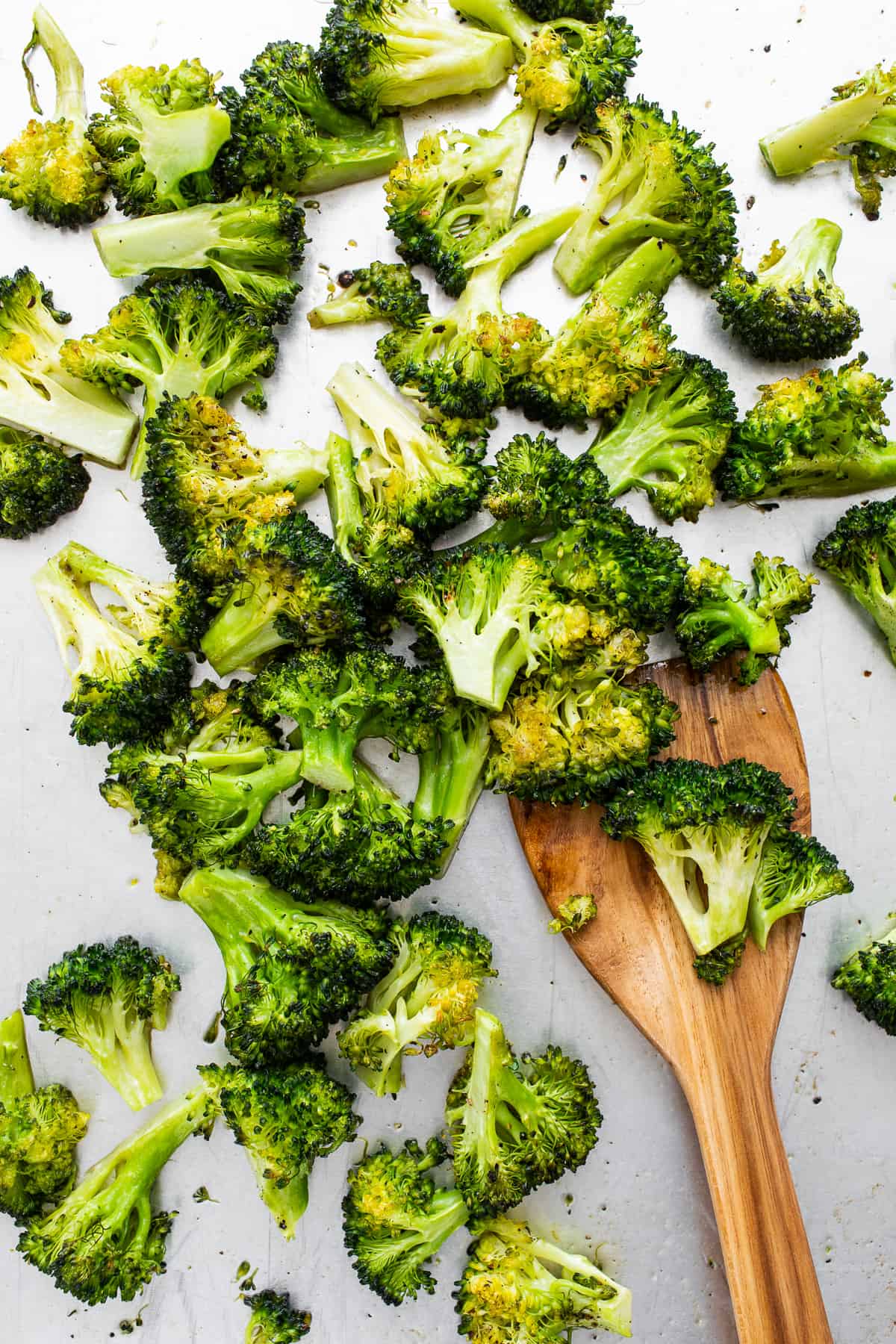 Roasted broccoli on a spatula.