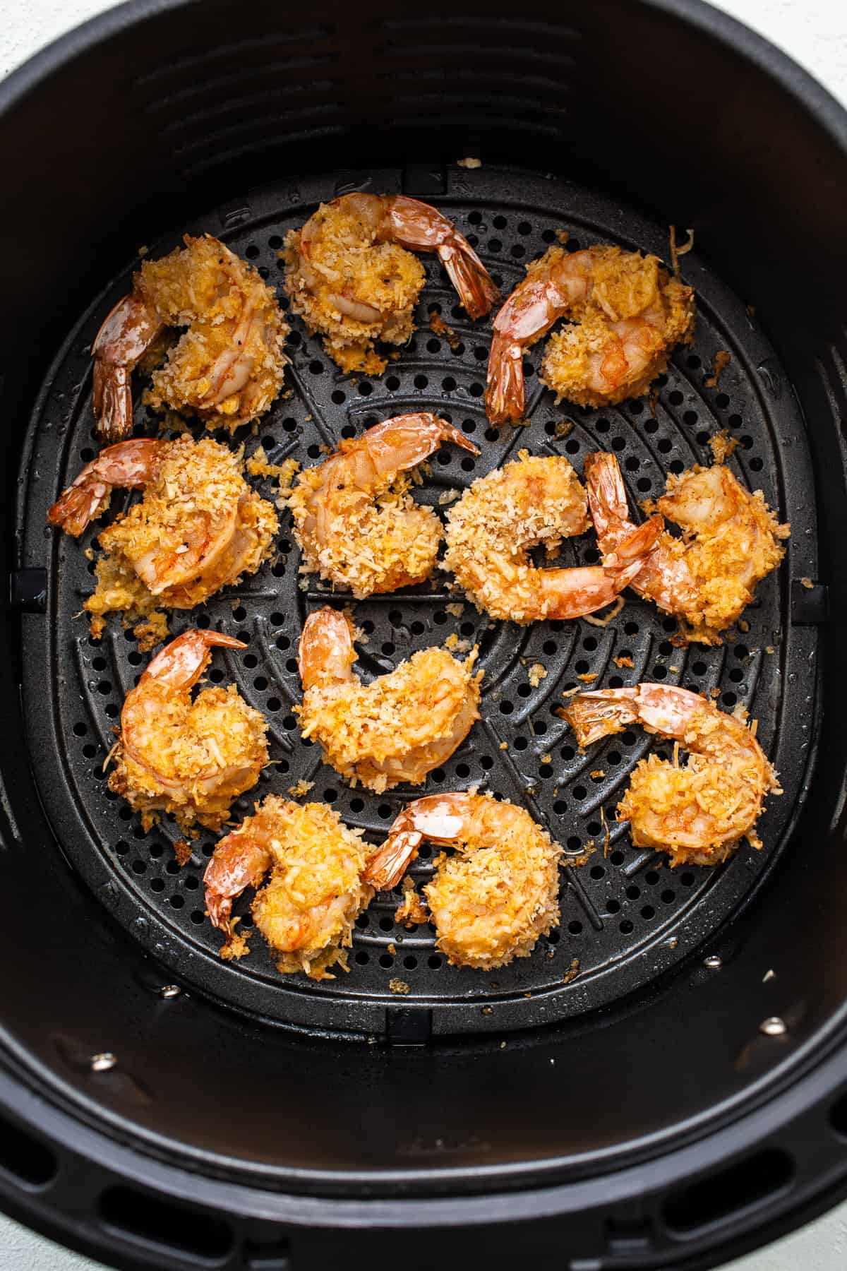 Cooked shrimp in an air fryer.