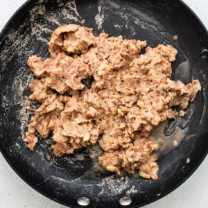 refried beans in pan.