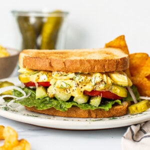 Egg salad sandwich on a plate.