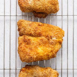 Air fryer fish on a cooling rack.