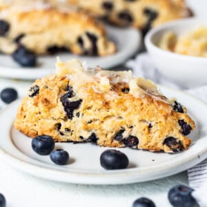 a close up of a plate of blueberry scones.