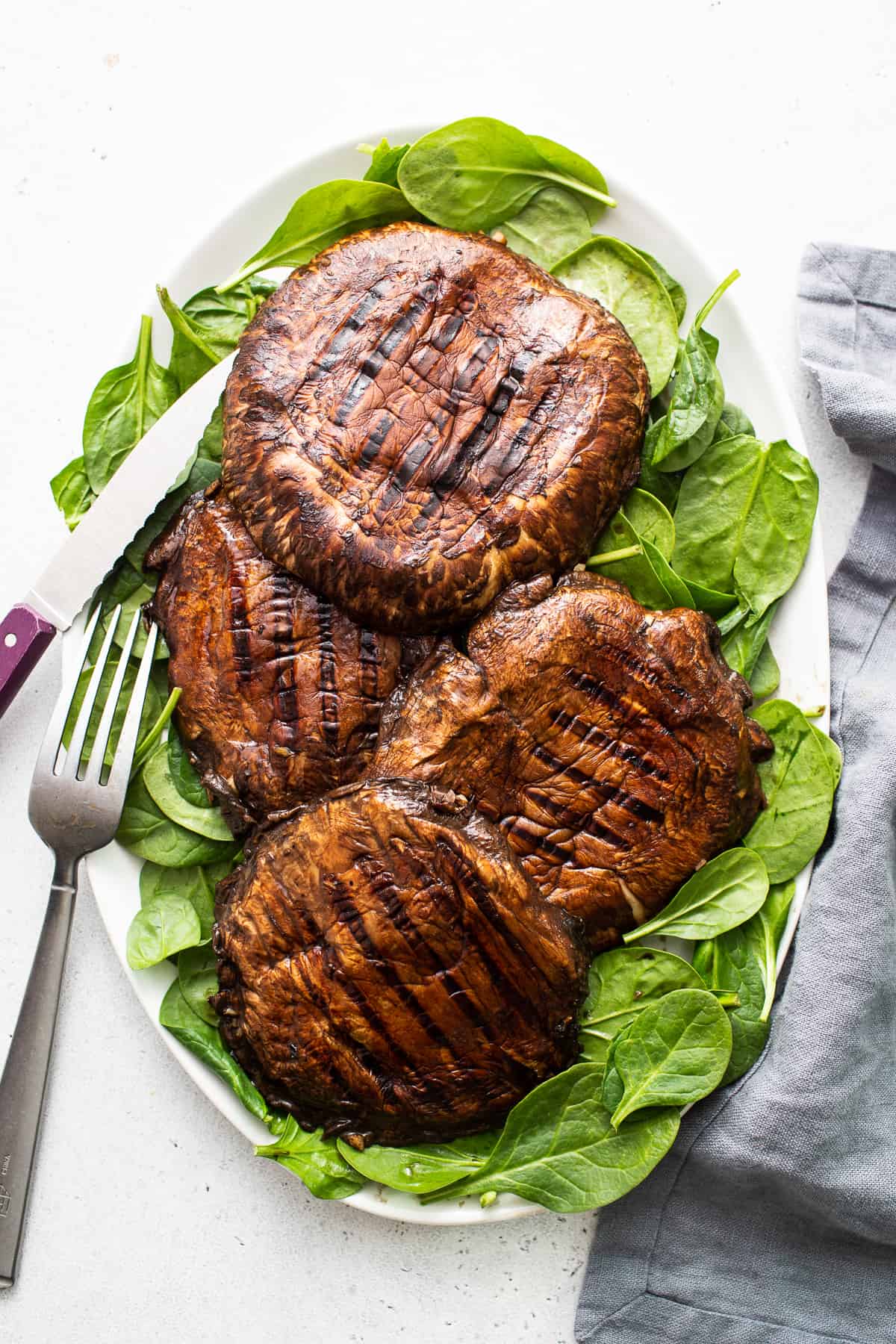 Grilled portobello mushrooms on a plate.