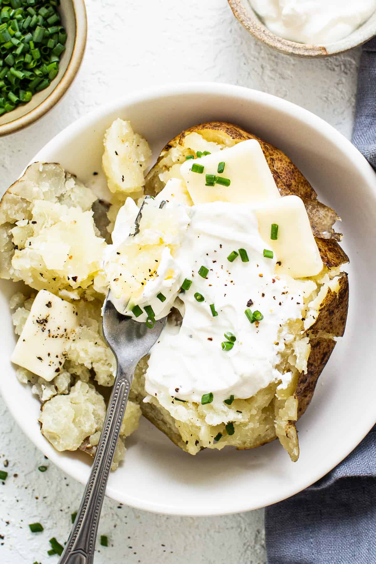 baked potato in bowl.