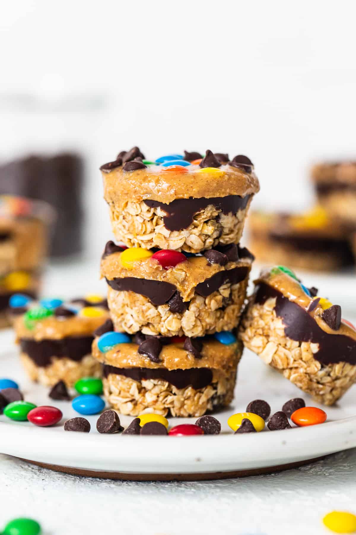 Monster cookie oat cups stacked on top of each other.