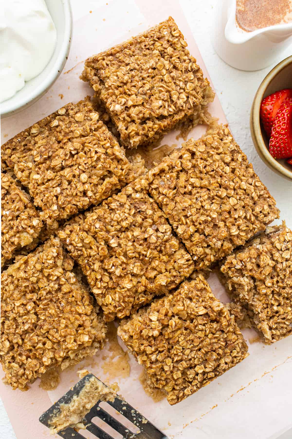 Tres leches baked oatmeal sliced on a cutting board.