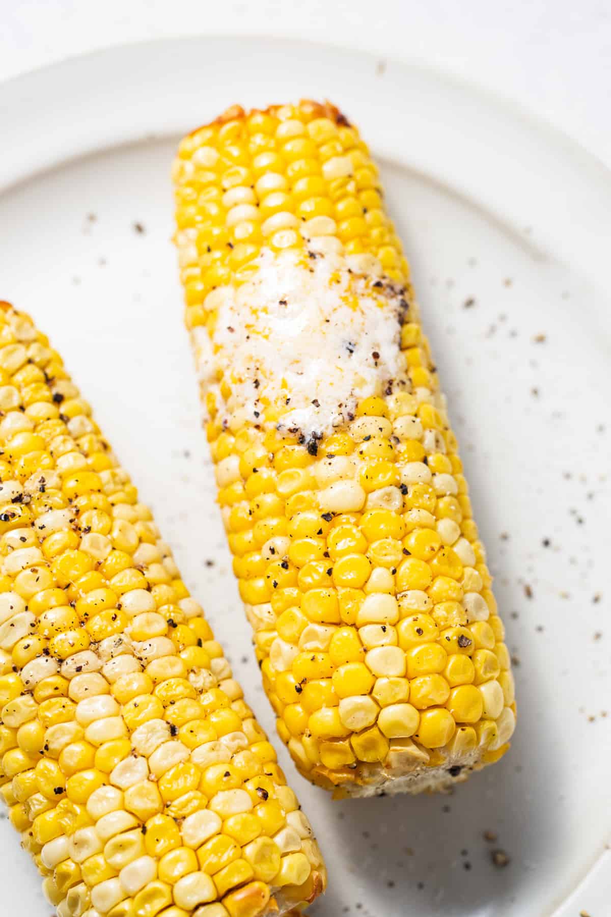 Corn on the cob on a plate.