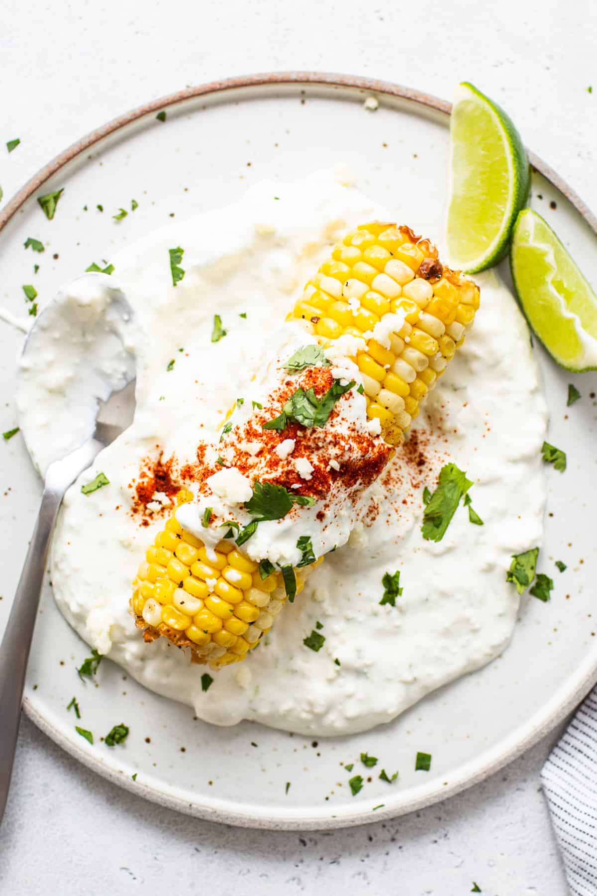 Air fryer elote on a plate.