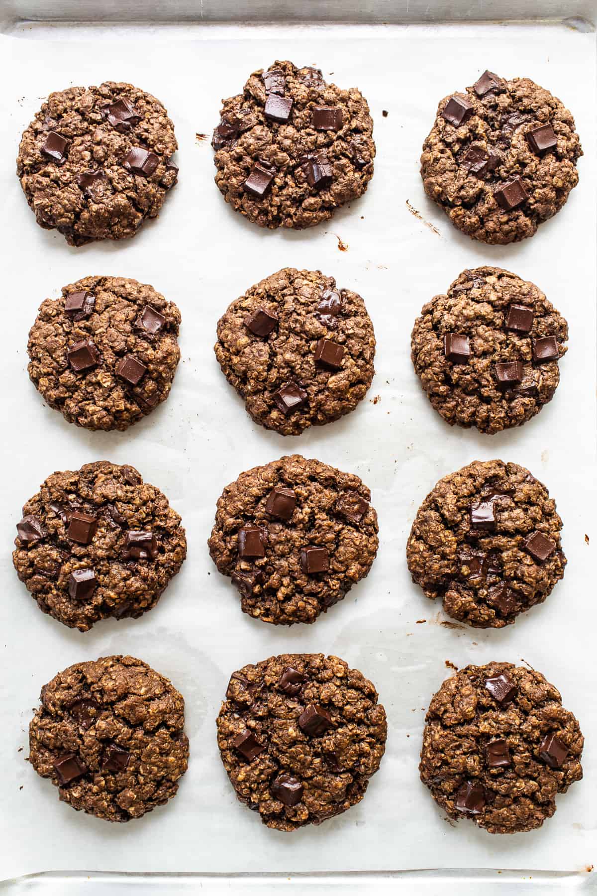 Chocolate oatmeal cookies on a baking sheet.