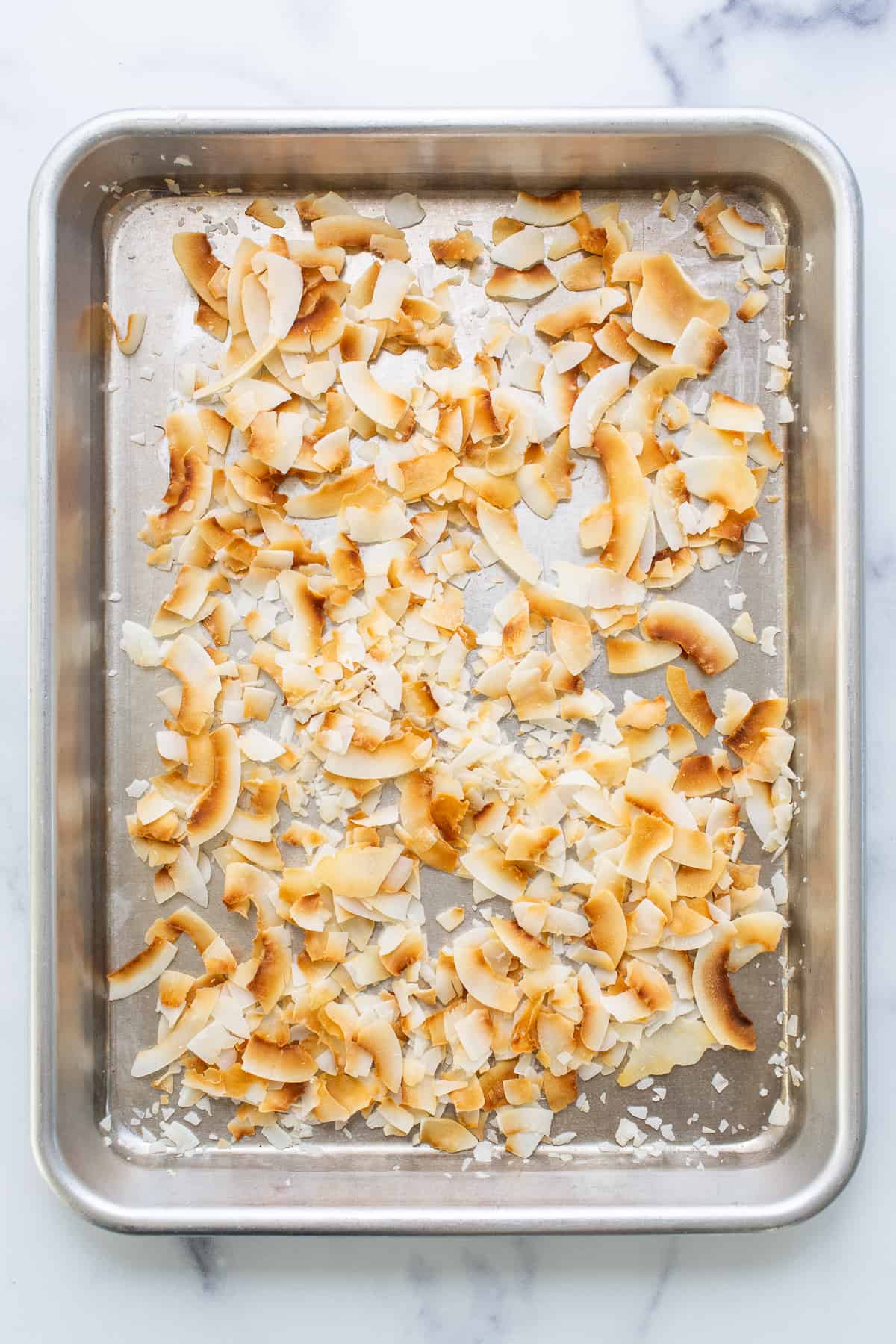 a metal pan filled with food on top of a counter.