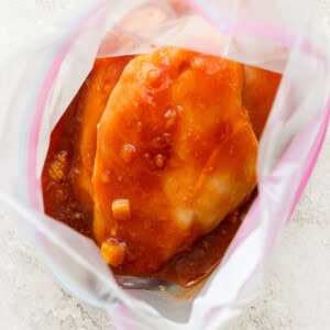 a close up of a chicken in a plastic bag.