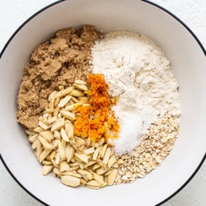 A bowl with ingredients for a pumpkin bread.