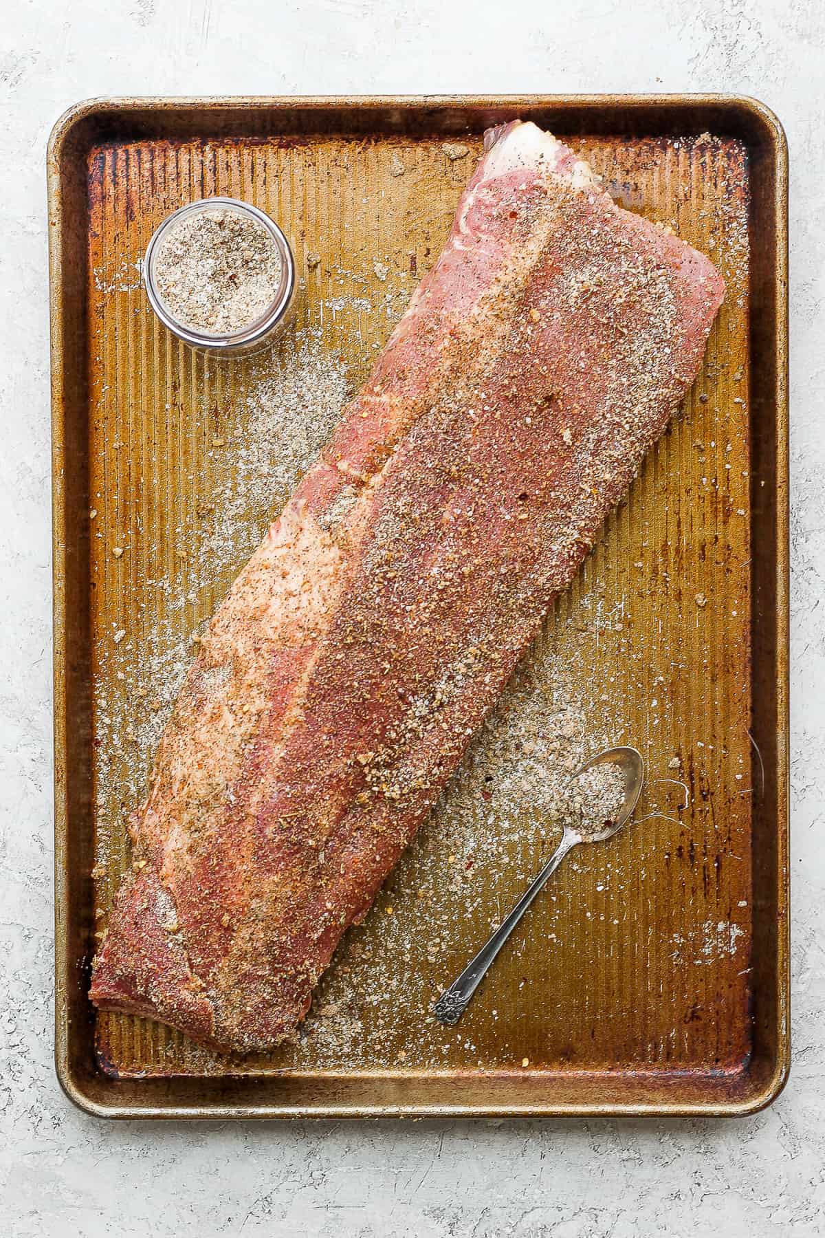 Dry rub on a rack of ribs.