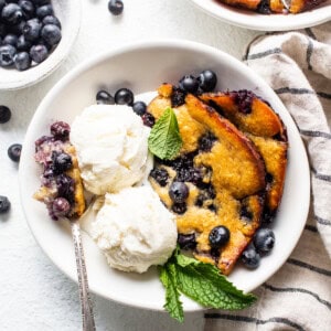 cobbler in bowl with ice cream.