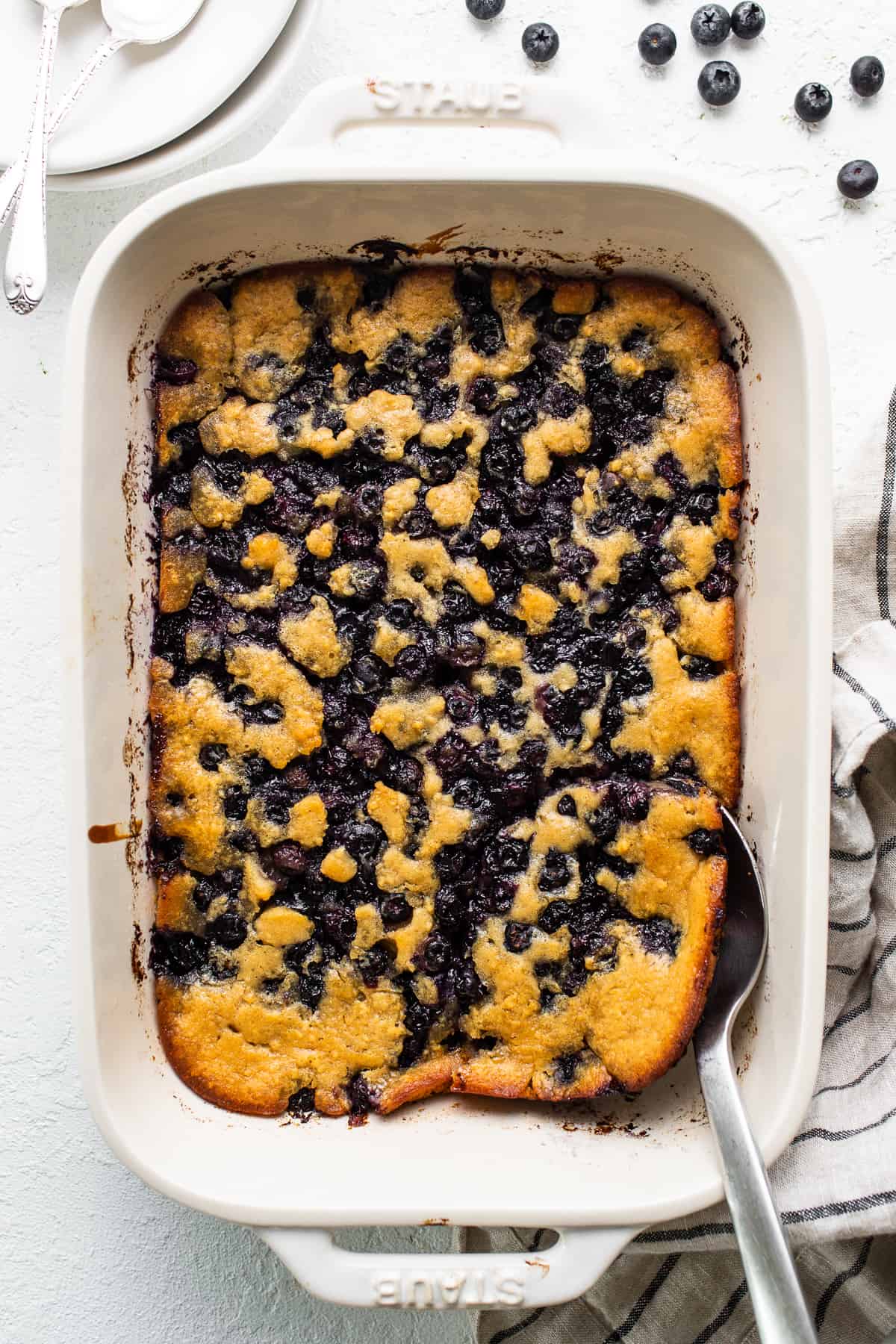 blueberry cobbler in baking dish.