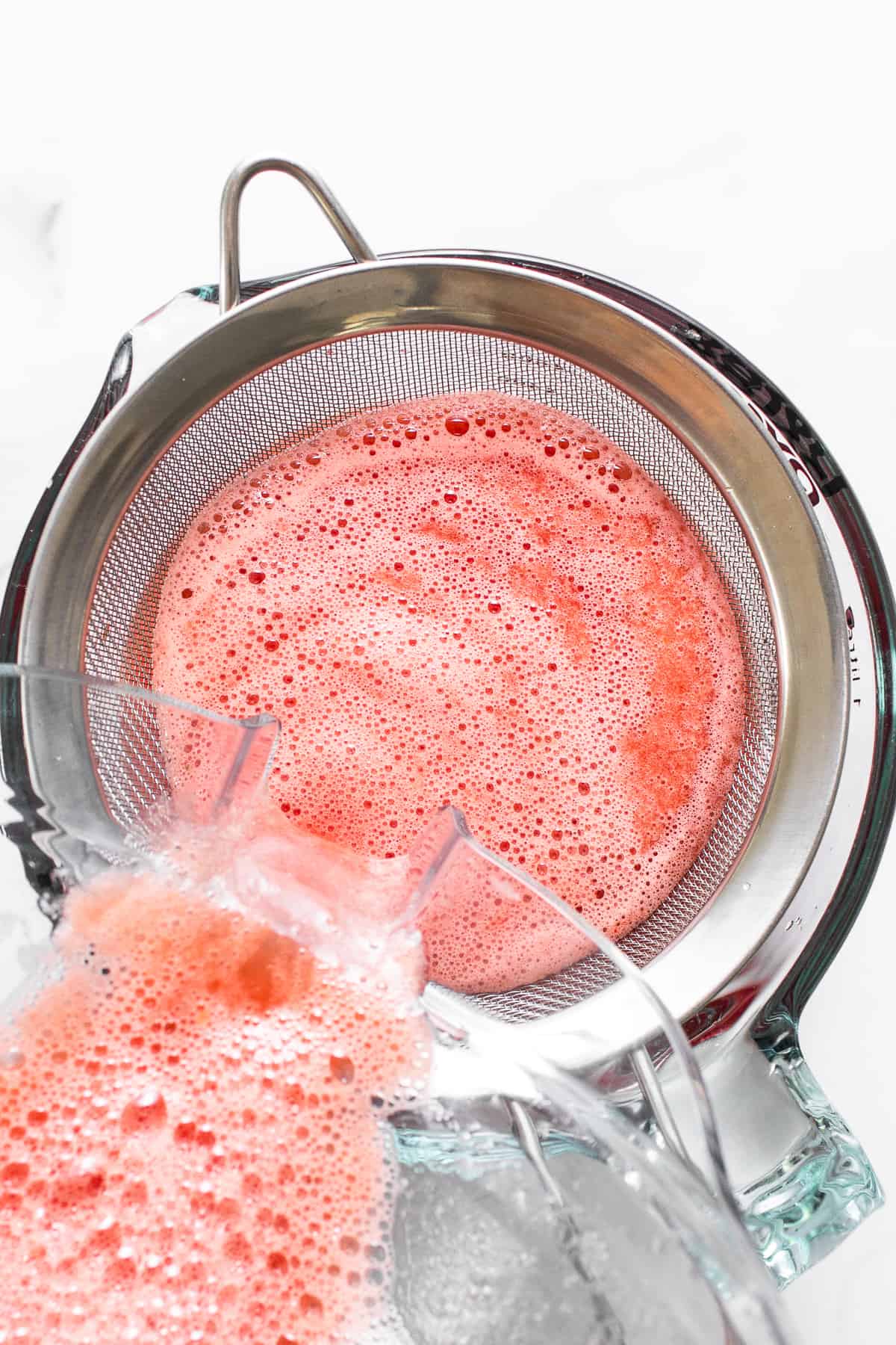 sieving watermelon juice.