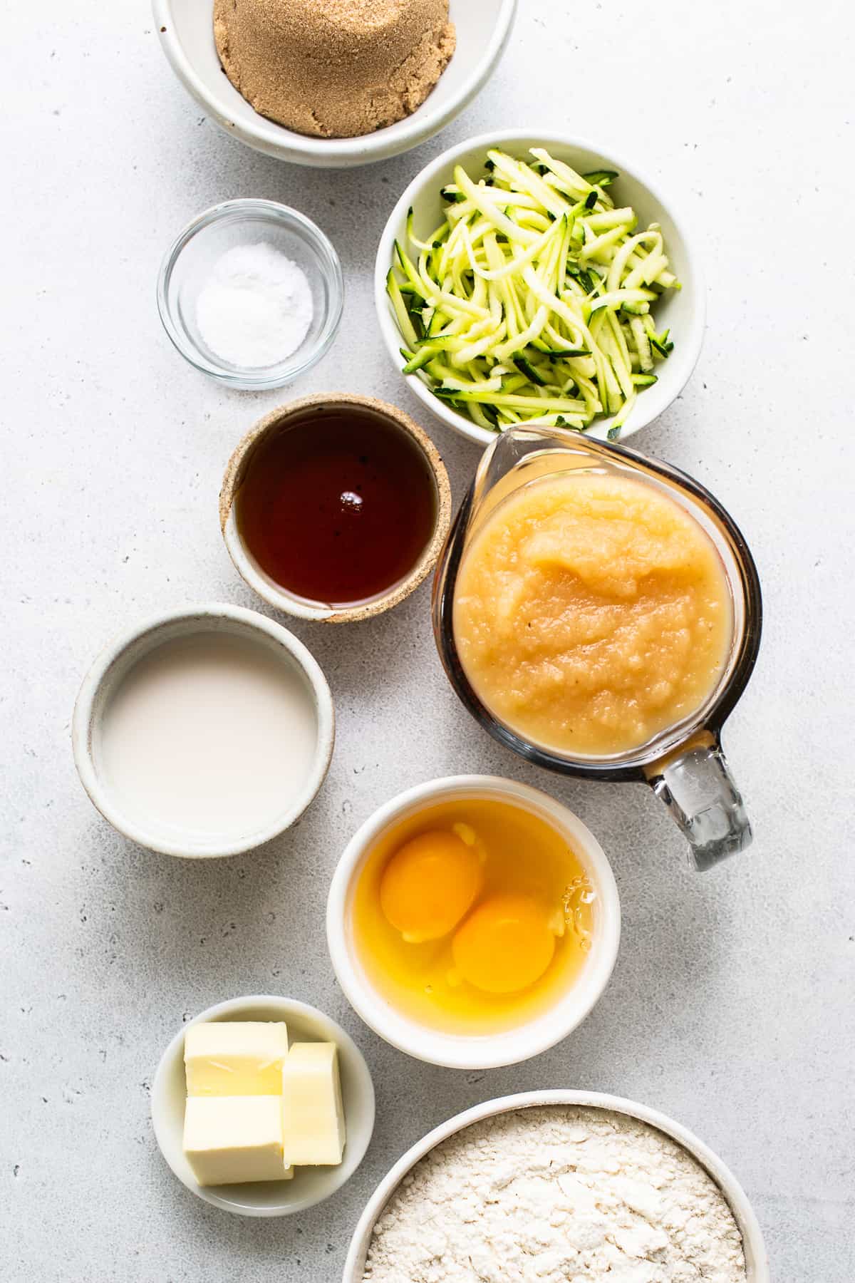 a table topped with bowls filled with different types of food.