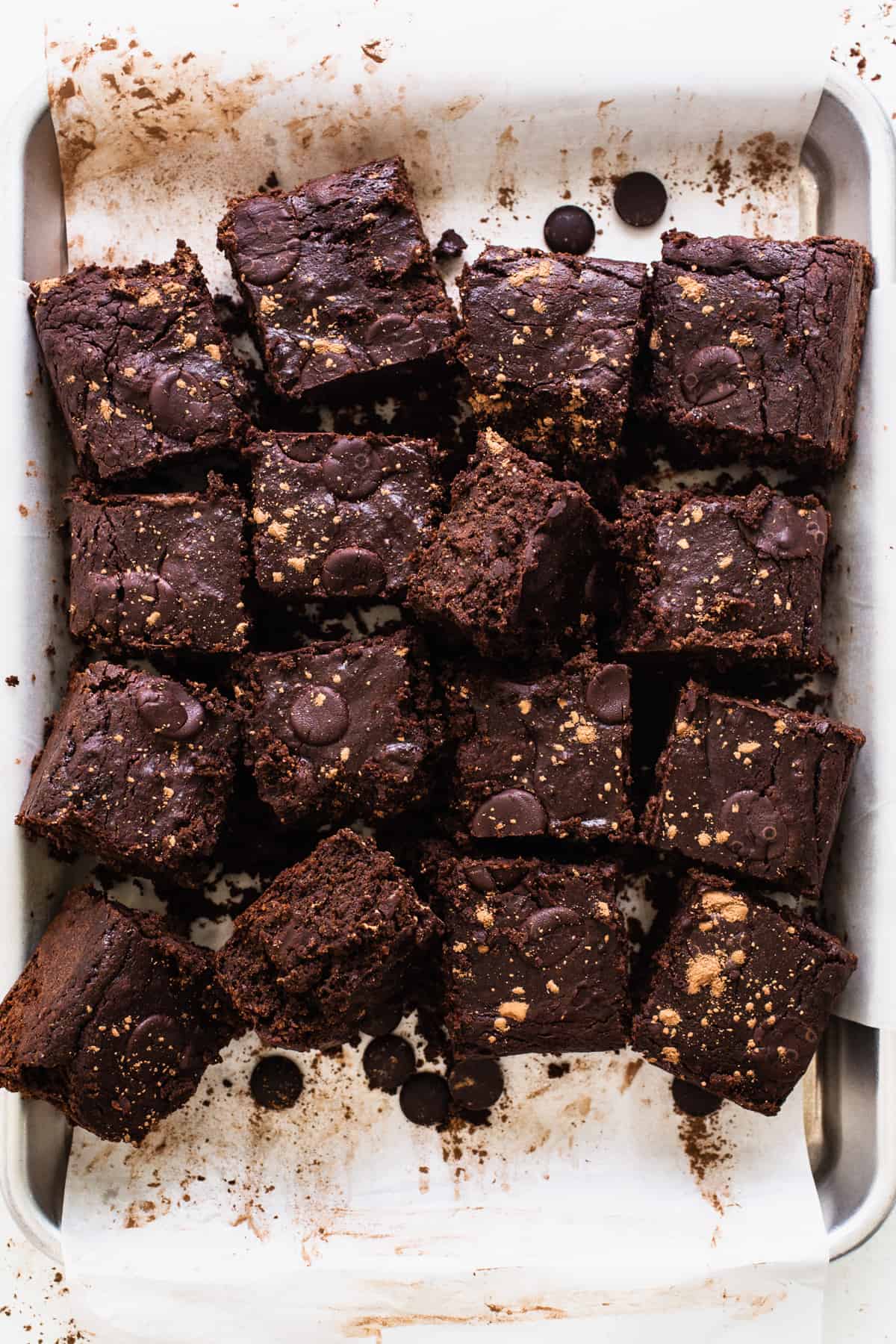 a pan filled with brownies covered in chocolate chips.